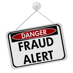 A red white and black sign with the word Scam Alert isolated on a white background Danger Fraud Alert